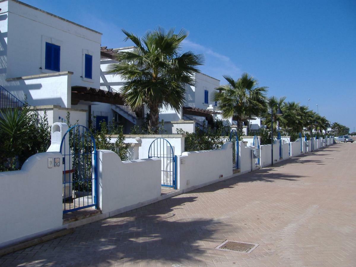 Villa In Villaggio Порто Чезарео Екстериор снимка